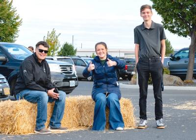 SAGE Staff giving a thumbs up at the Harvest Festival