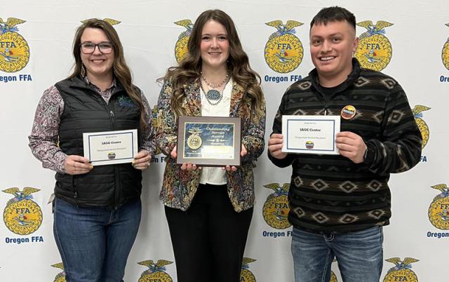 Breanna Harris, Celilo Brun, and Angel Aguilar receive the Distinguished Service Award at the Oregon FFA Convention